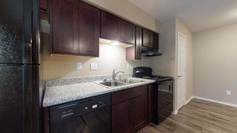 a kitchen with a sink and a refrigerator
